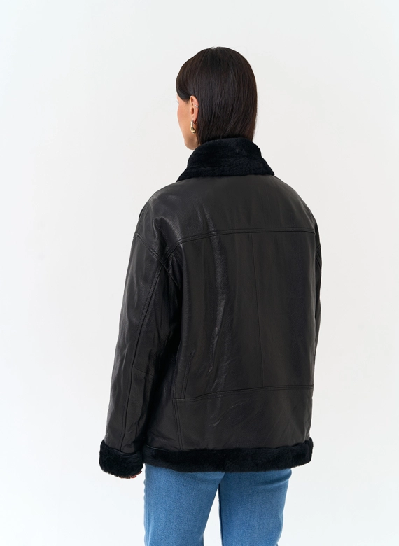Женский пуховик из натуральной кожи фото